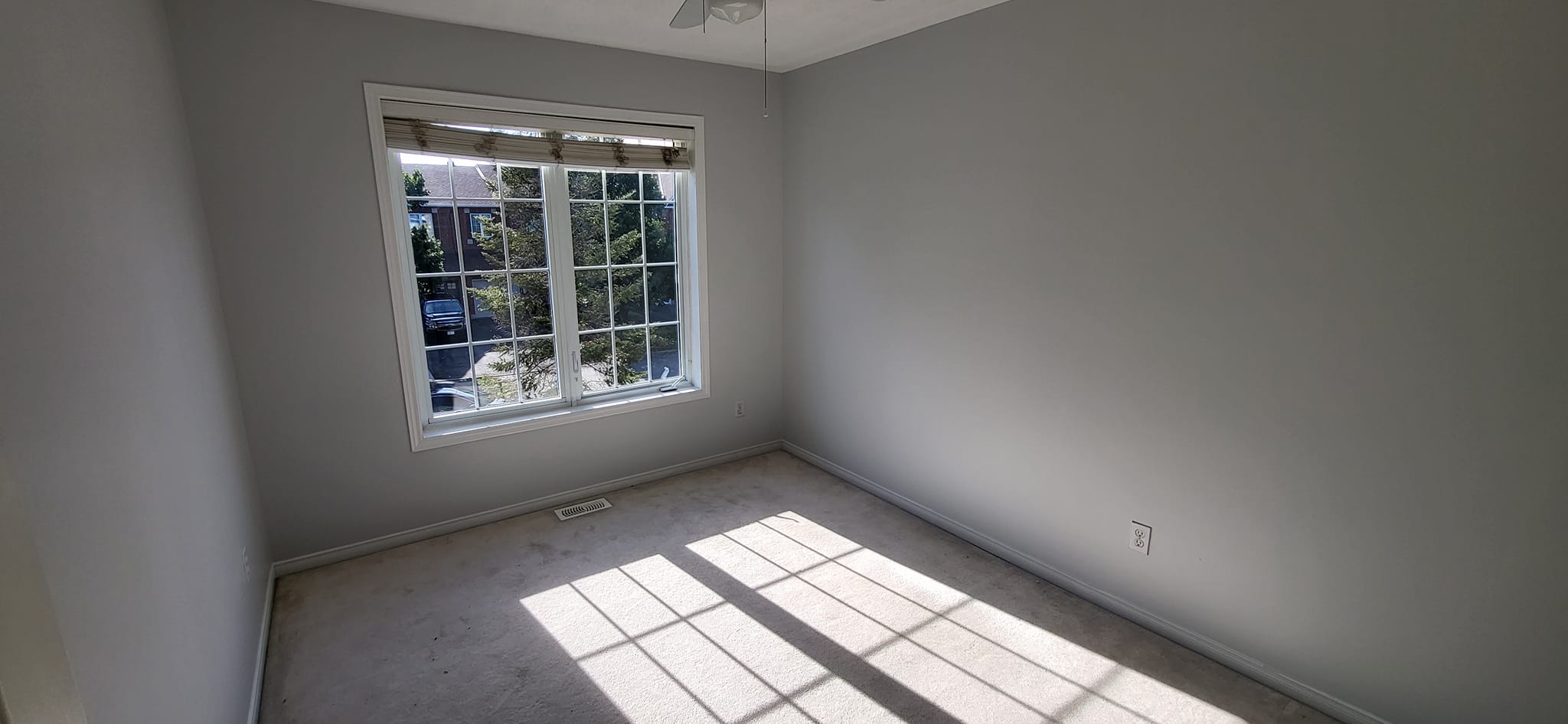 Bedroom with professional gray paint finish